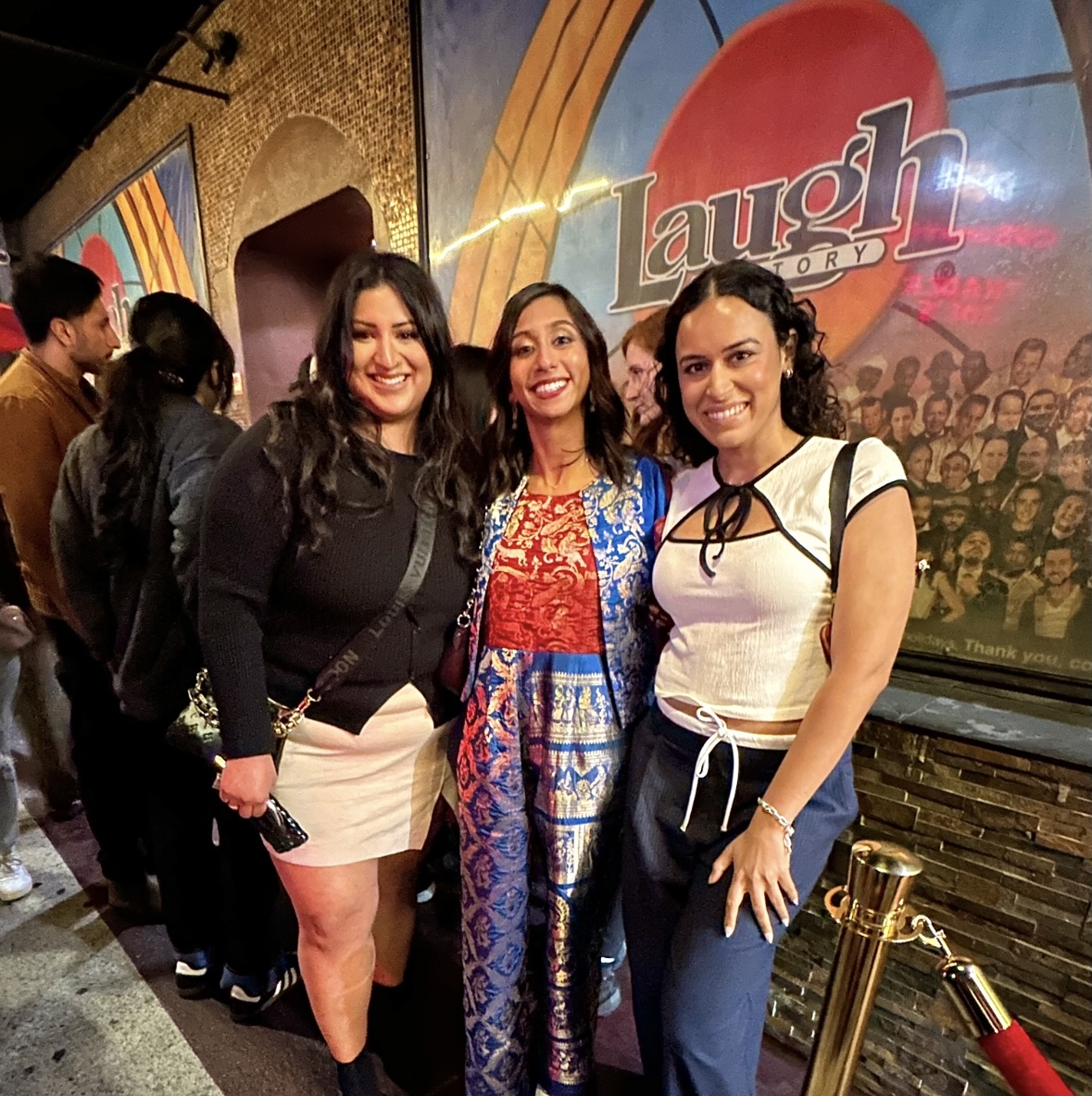 Priya with two guests at the Laugh Factory