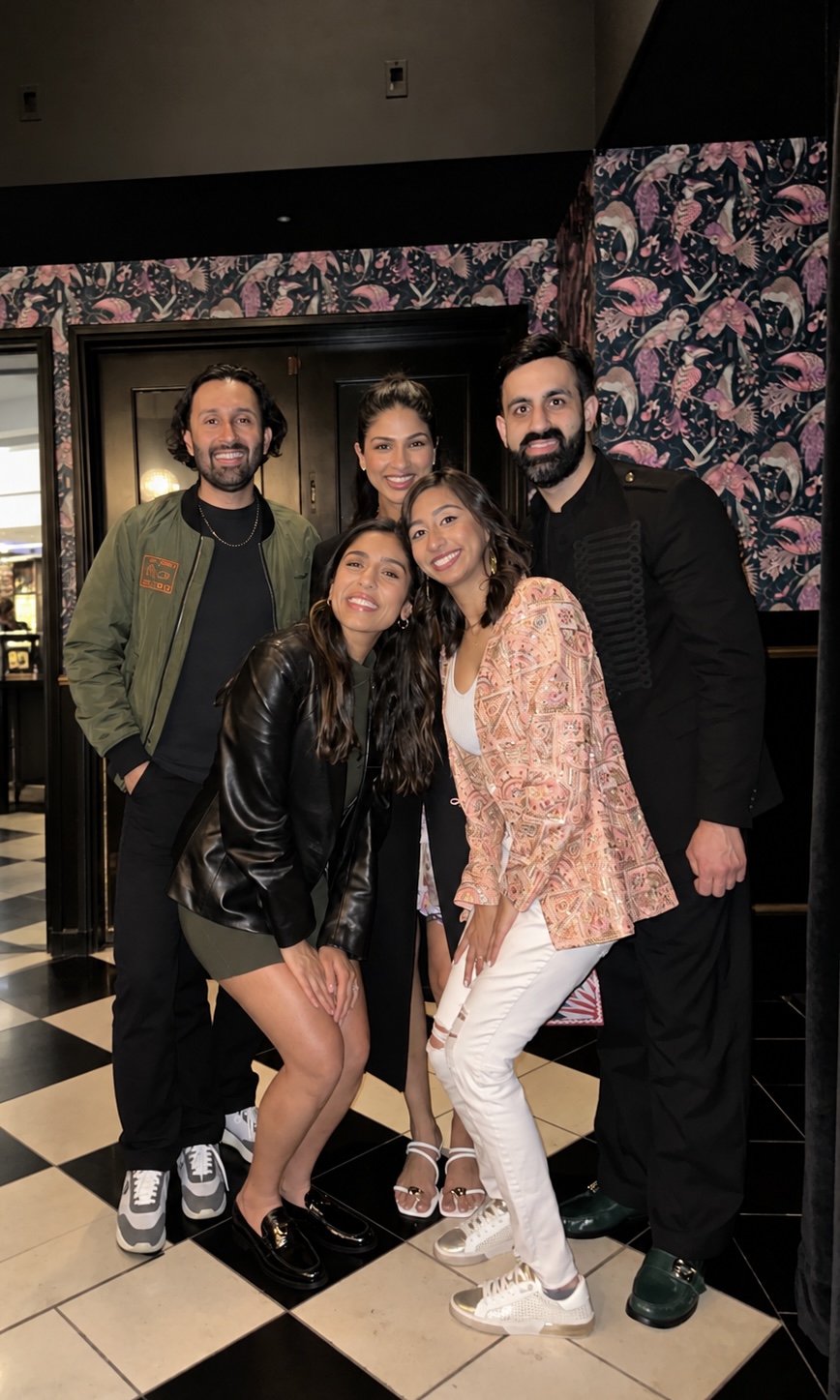 Priya with guests and fellow creatives at a comedy event