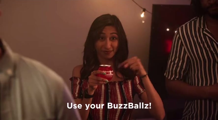 Priya holding a BuzzBallz drink in a digital commercial